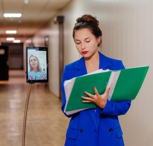 Business conversation using telepresence robot